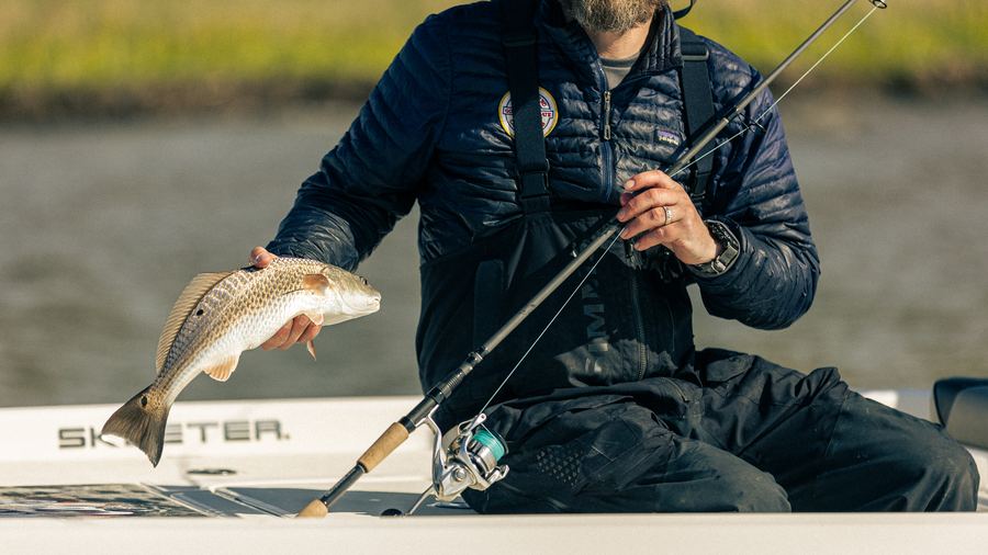 Guide with a bass, Sawgrass rod visible